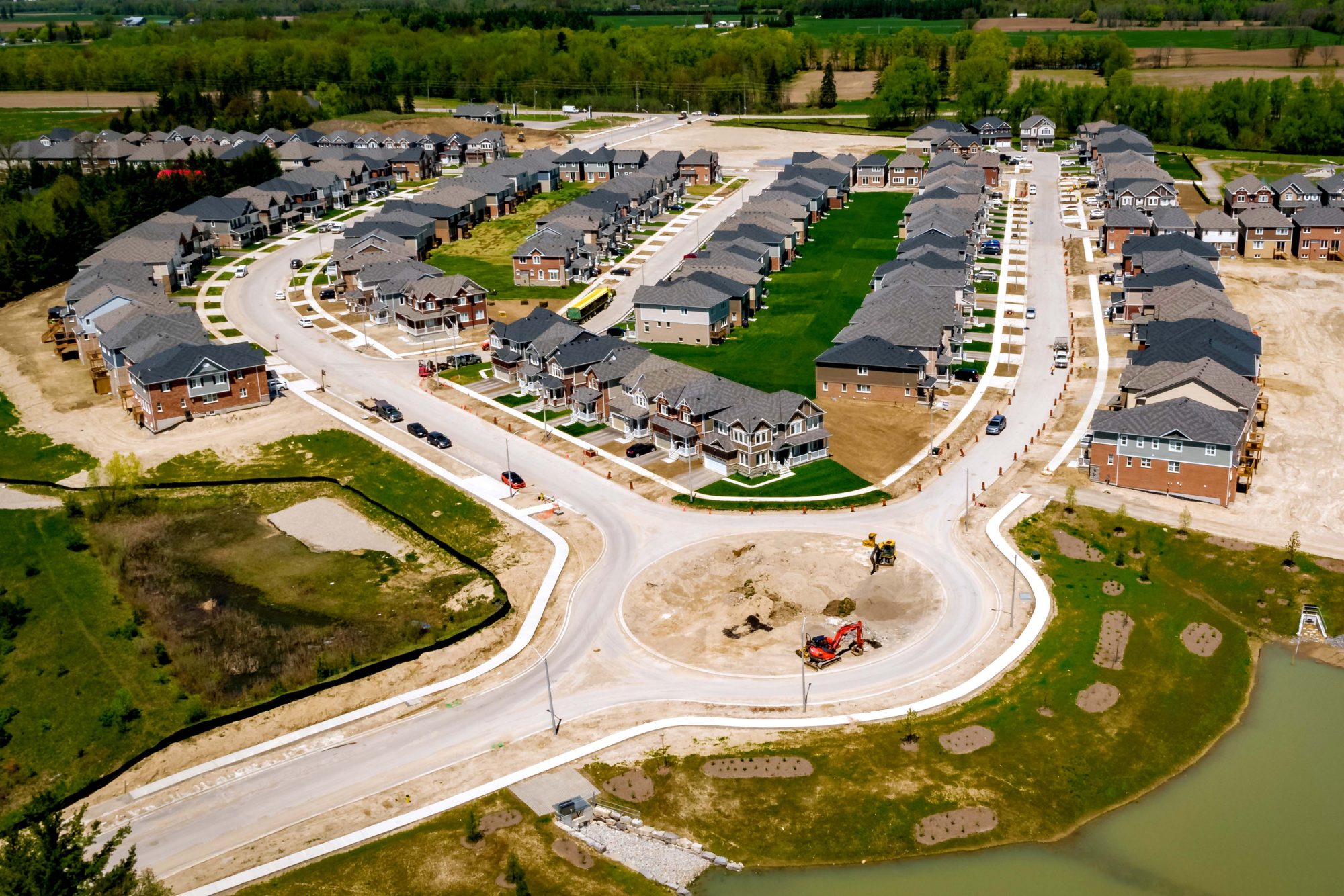 Aerial view of a subdivision with landscaping still under construction.